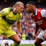 découvrez l'instant choc où erling haaland et gabriel magalhães s'affrontent dans un accrochage intense lors d'un match palpitant, révélant toute la tension du terrain.