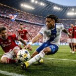 bundesliga : olise offre un match nul précieux au bayern munich avant leur affrontement crucial contre le psg, garantissant un suspense intense en championnat.